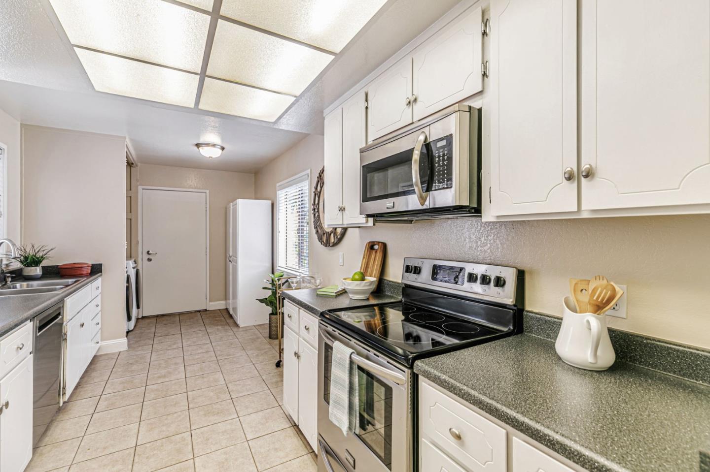 6200 Gerdts Drive San Jose, CA 95135 - Photo 20 of 39 a kitchen with stainless steel appliances granite countertop a sink stove and cabinets