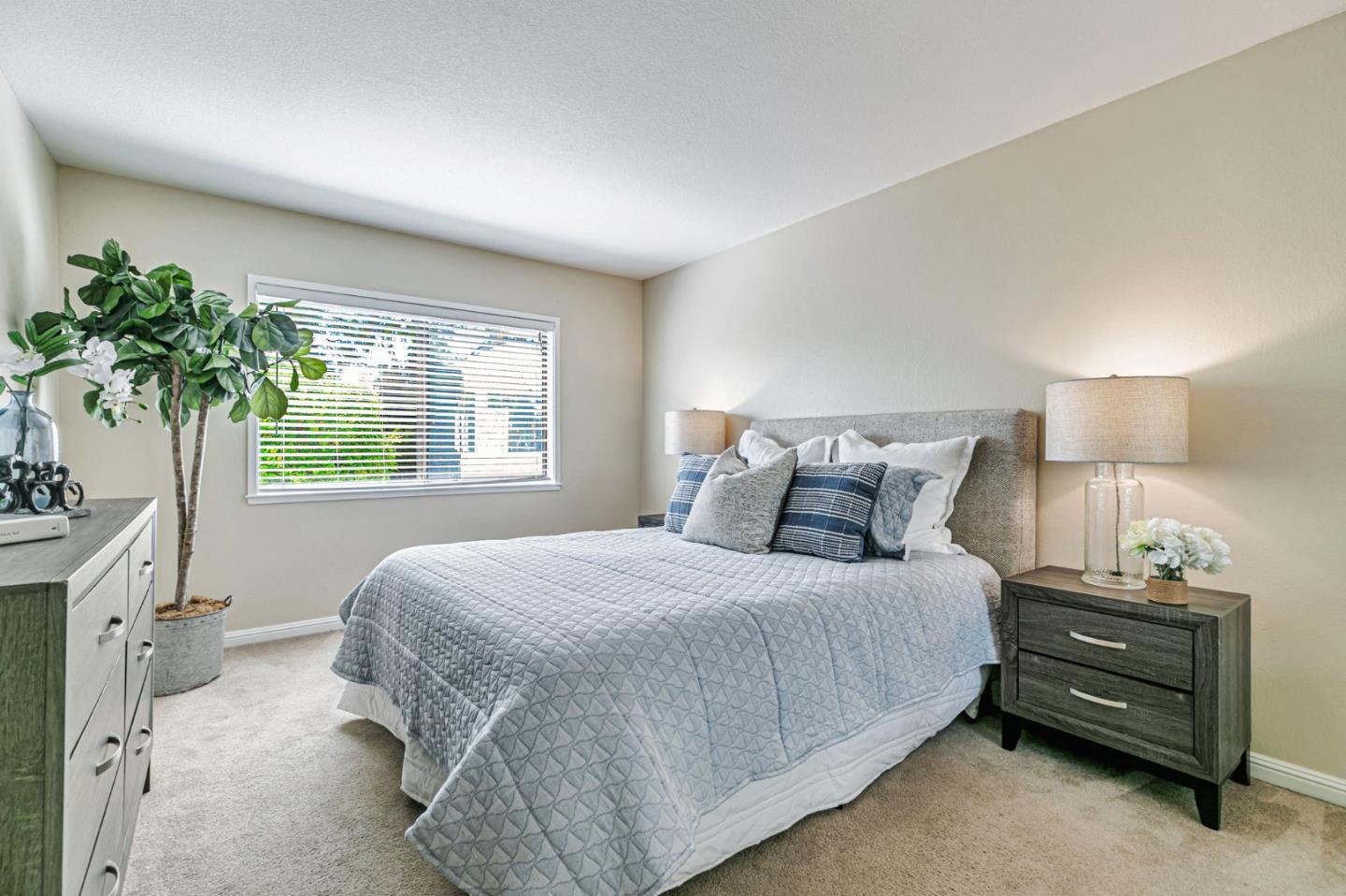 6200 Gerdts Drive San Jose, CA 95135 - Photo 26 of 39 a bedroom with a bed window and potted plant