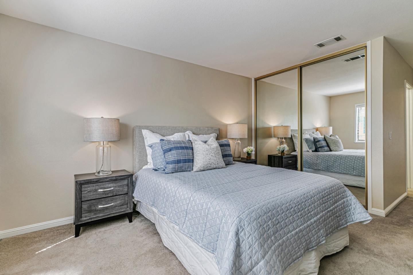 6200 Gerdts Drive San Jose, CA 95135 - Photo 7 of 39 a bedroom with a bed and a lamp on table