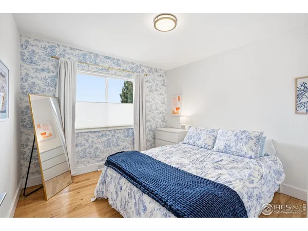 a bedroom with a bed and a view of bathroom