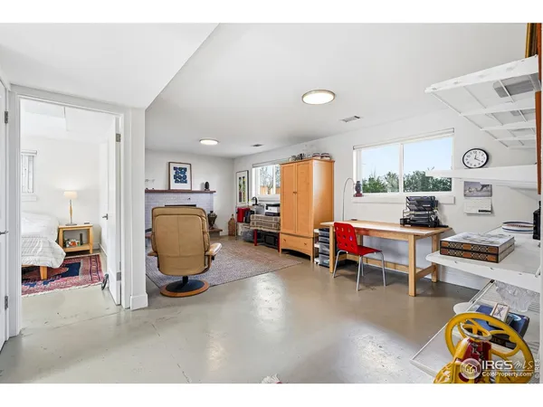 a bedroom with a bed and a table in it
