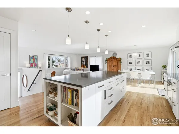 a kitchen with stainless steel appliances kitchen island granite countertop a sink and cabinets