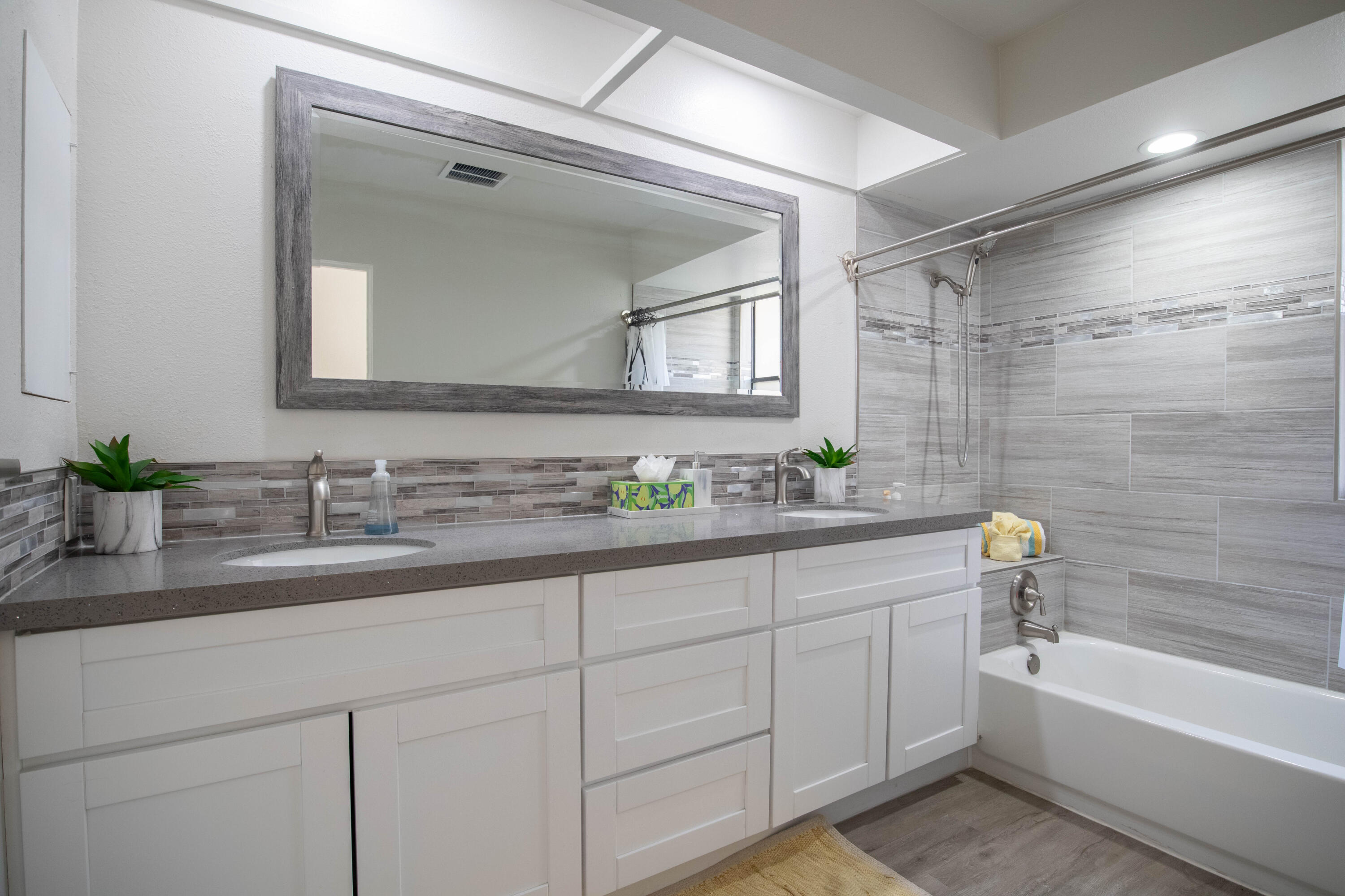 46560 Arapahoe Circle, Unit B Indian Wells, CA 92210 - Photo 12 of 17 a bathroom with a sink double vanity granite tub shower and a mirror
