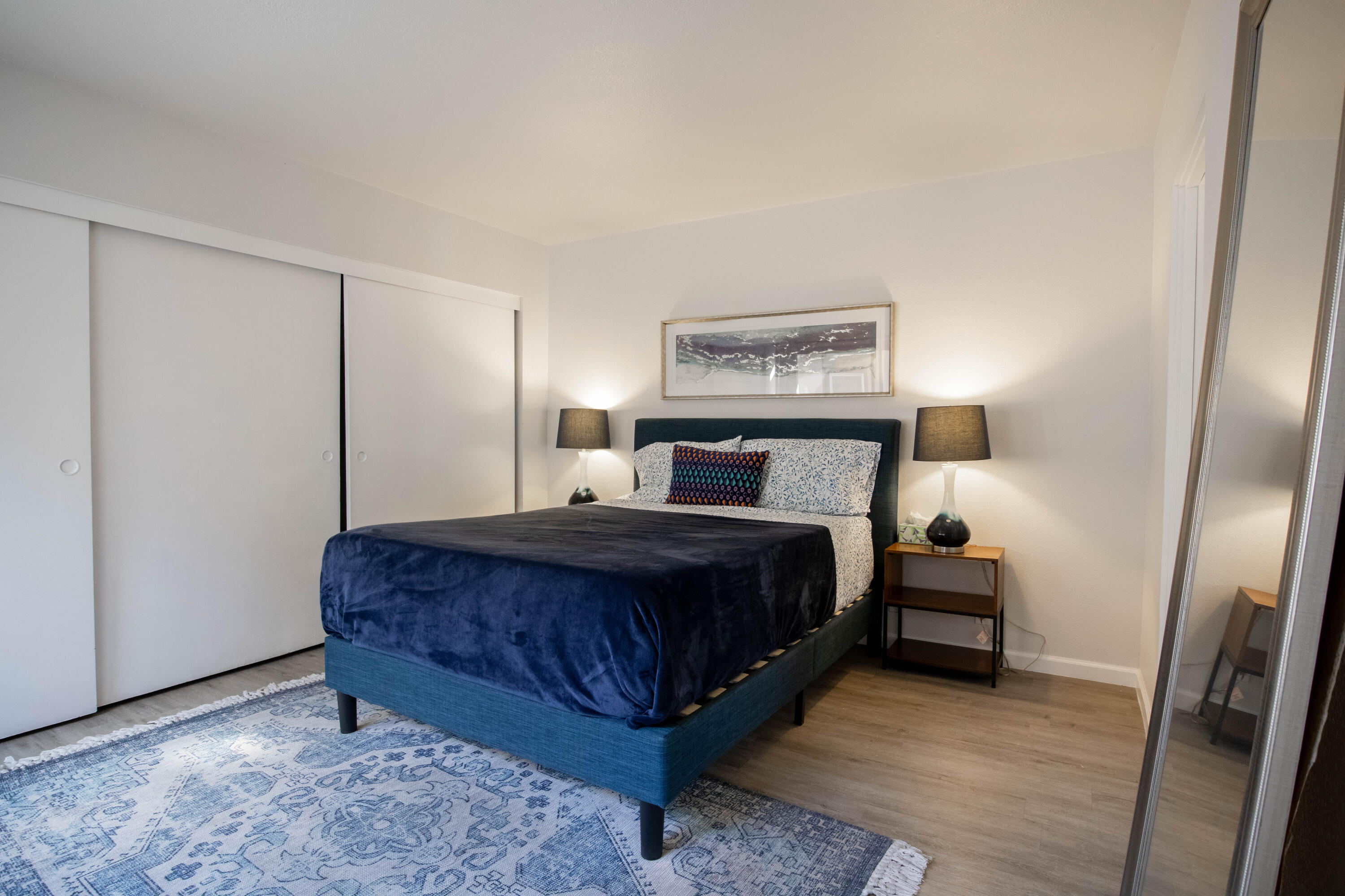 46560 Arapahoe Circle, Unit B Indian Wells, CA 92210 - Photo 13 of 17 a bedroom with a bed and a night stand