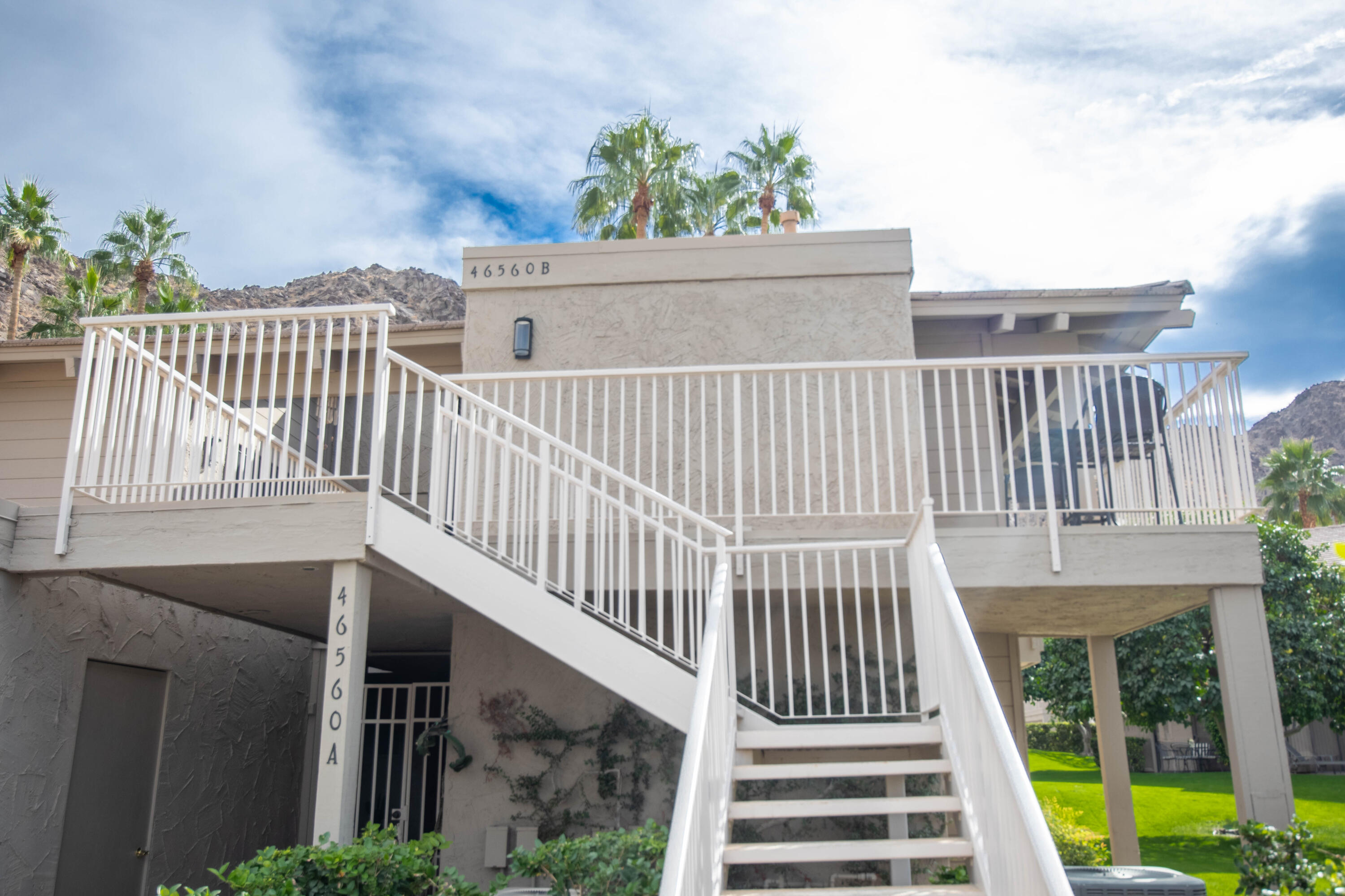 46560 Arapahoe Circle, Unit B Indian Wells, CA 92210 - Photo 15 of 17 a view of balcony with wooden floor and fence