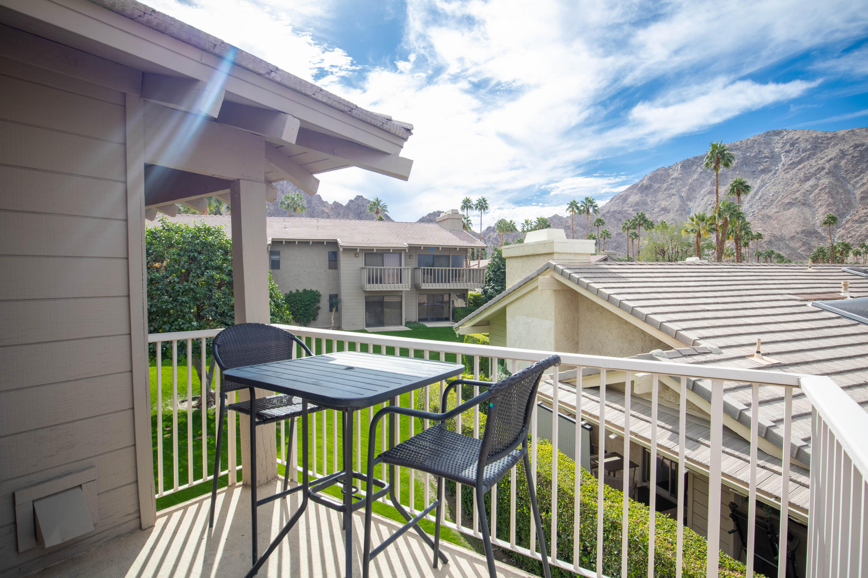 46560 Arapahoe Circle, Unit B Indian Wells, CA 92210 - Photo 2 of 17 a view of a patio with a table chairs and a potted plant