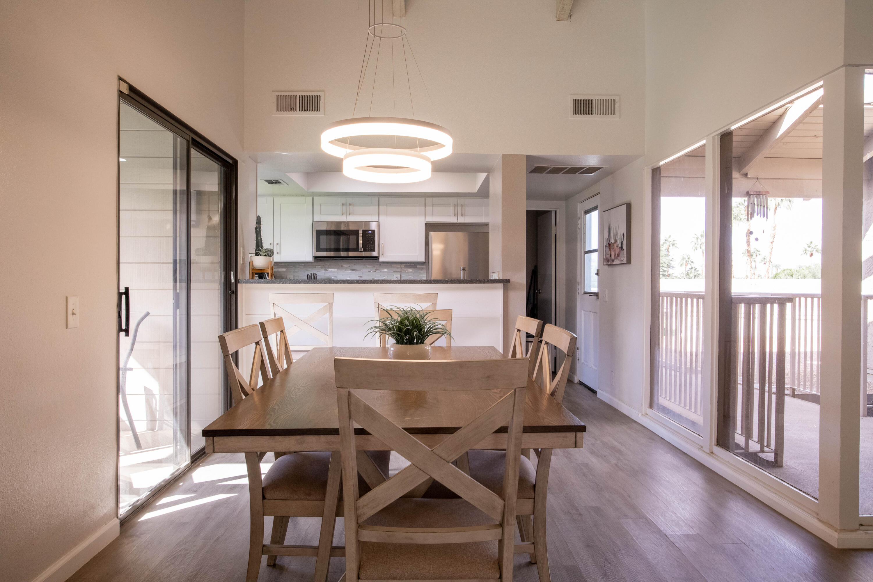46560 Arapahoe Circle, Unit B Indian Wells, CA 92210 - Photo 9 of 17 a view of a dining room with furniture window and wooden floor