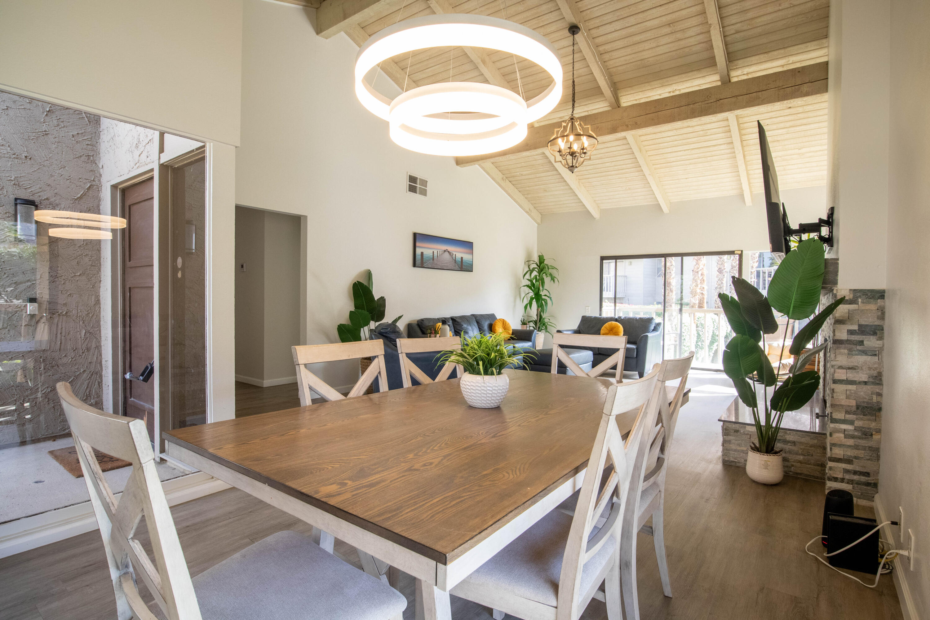 46560 Arapahoe Circle, Unit B Indian Wells, CA 92210 - Photo 10 of 17 a view of a dining room with furniture and a potted plant