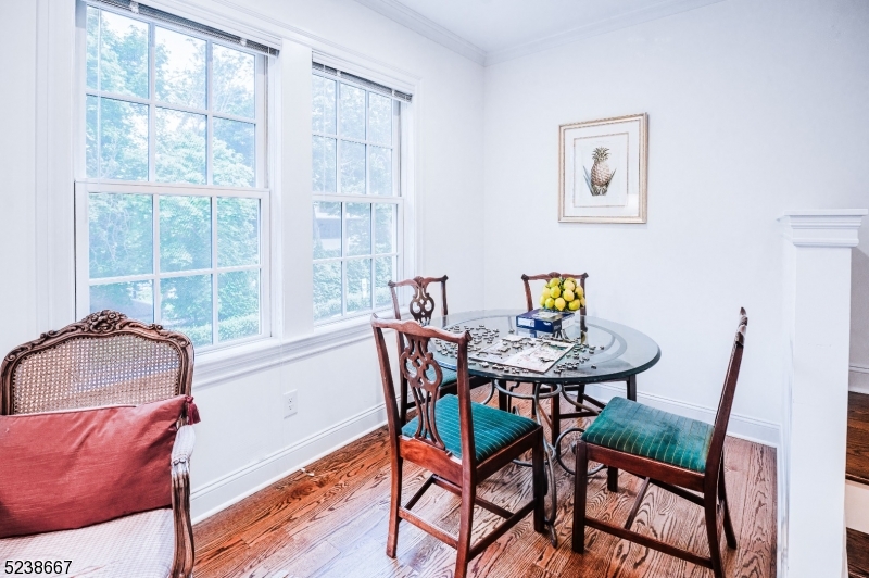 29 Euclid Avenue, Unit 203 Summit, NJ 07901 - Photo 6 of 25 a view of a dining room with furniture and a window