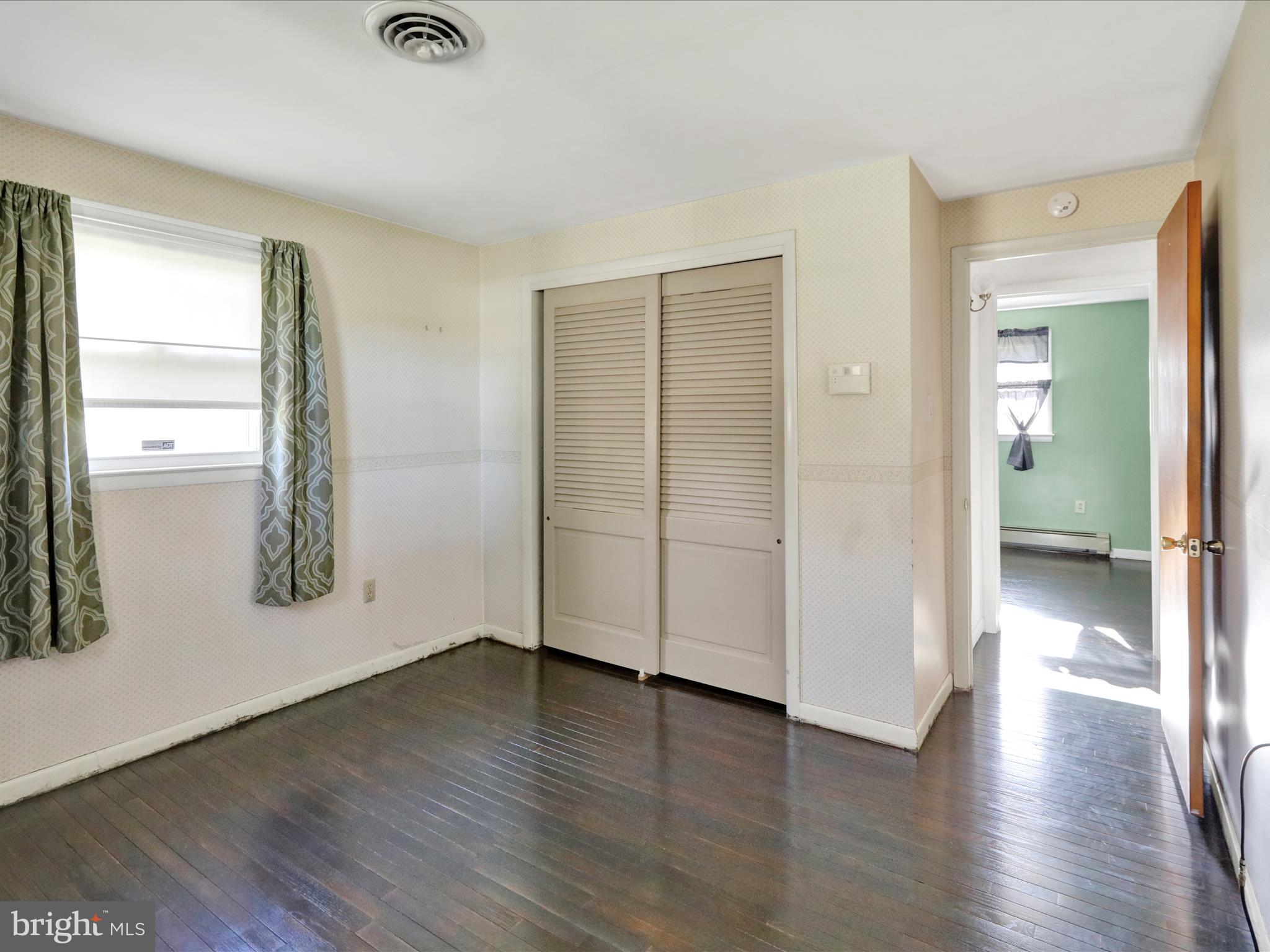 3908 Reading Crest Avenue Reading, PA 19605 - Photo 22 of 34 an empty room with wooden floor and windows