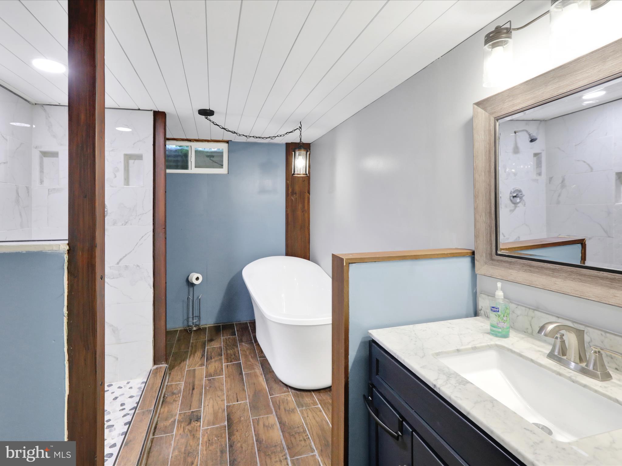 3908 Reading Crest Avenue Reading, PA 19605 - Photo 25 of 34 a bathroom with a granite countertop sink and a mirror