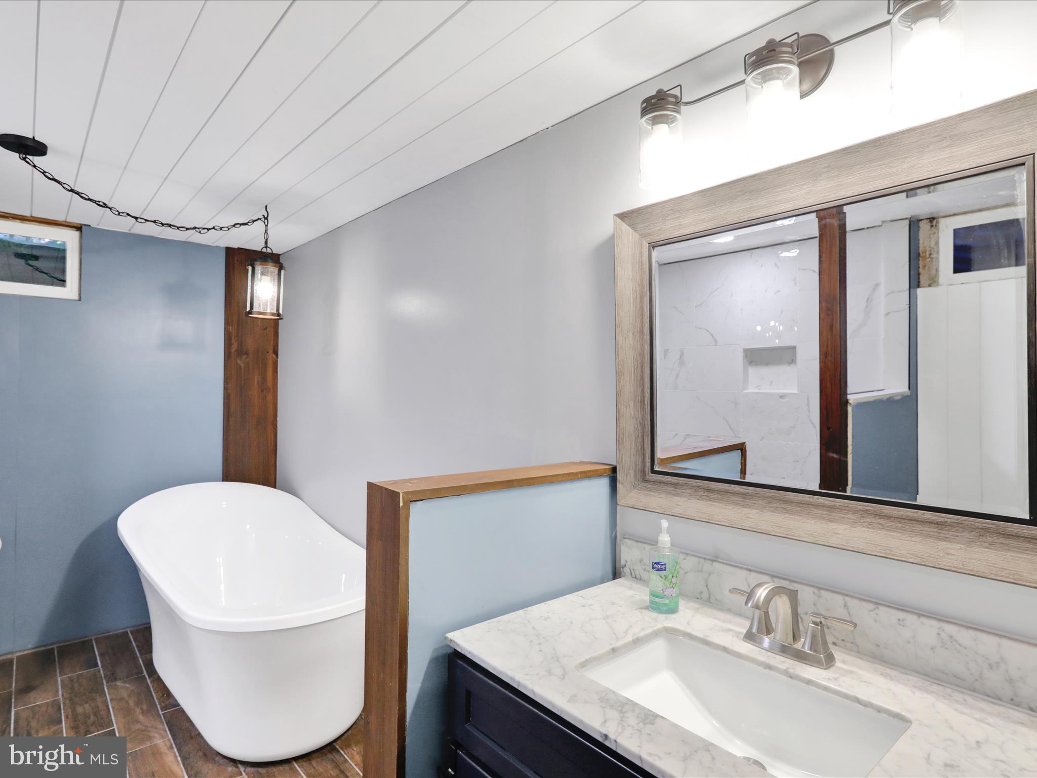 3908 Reading Crest Avenue Reading, PA 19605 - Photo 26 of 34 a bathroom with a granite countertop toilet sink and mirror