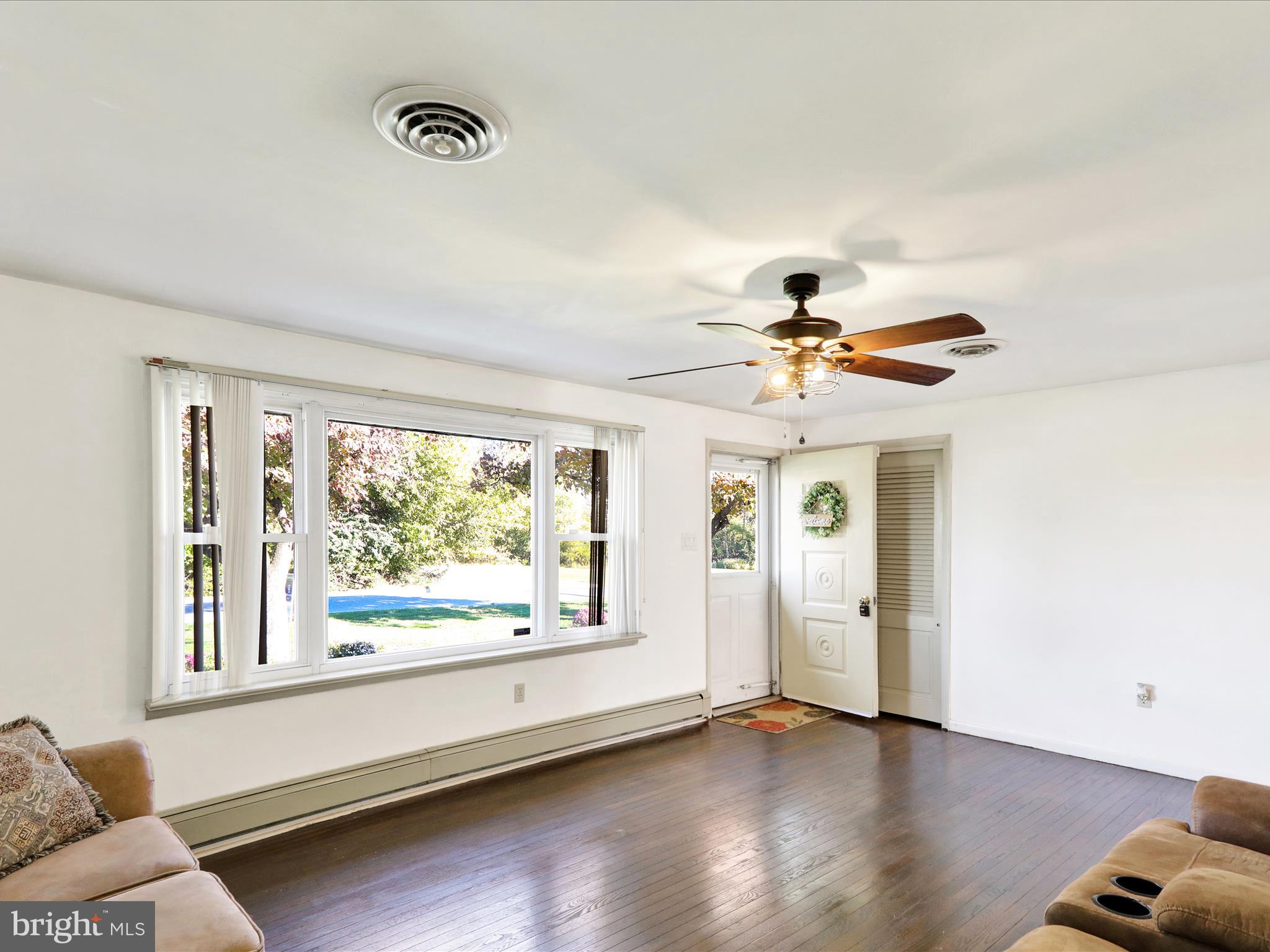 3908 Reading Crest Avenue Reading, PA 19605 - Photo 8 of 34 wooden floor in an empty room with a window