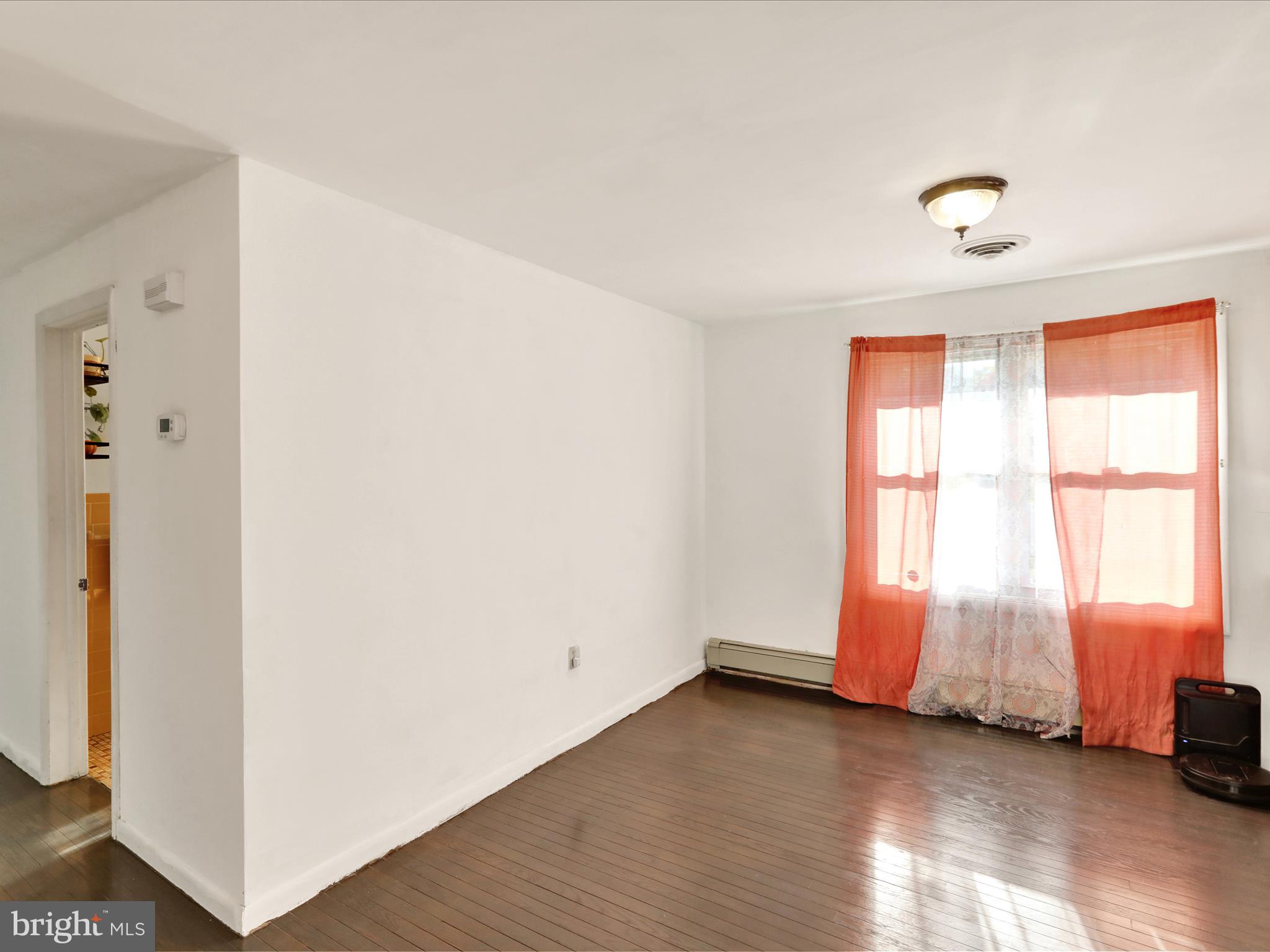 3908 Reading Crest Avenue Reading, PA 19605 - Photo 9 of 34 an empty room with wooden floor and windows