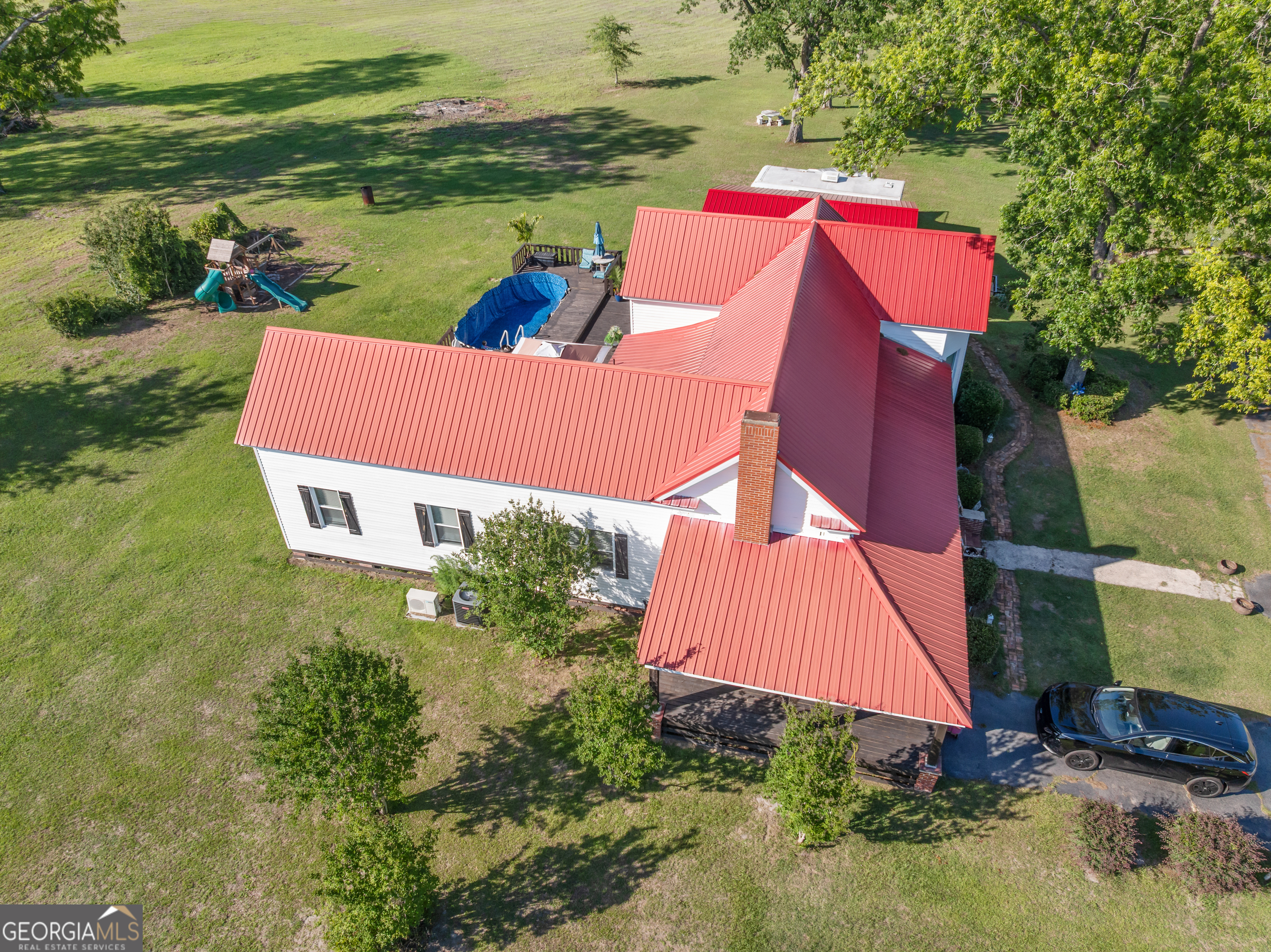 5065 10 Mile Road Baxley, GA 31513 - Photo 52 of 70 an aerial view of a house with pool a yard and outdoor seating