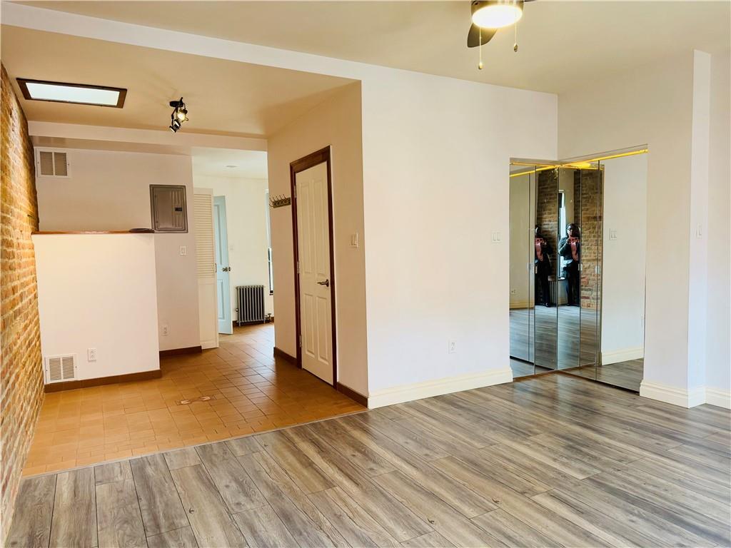 196 23rd Street Brooklyn, NY 11232 - Photo 4 of 11 a view of a hallway with wooden floor and closet