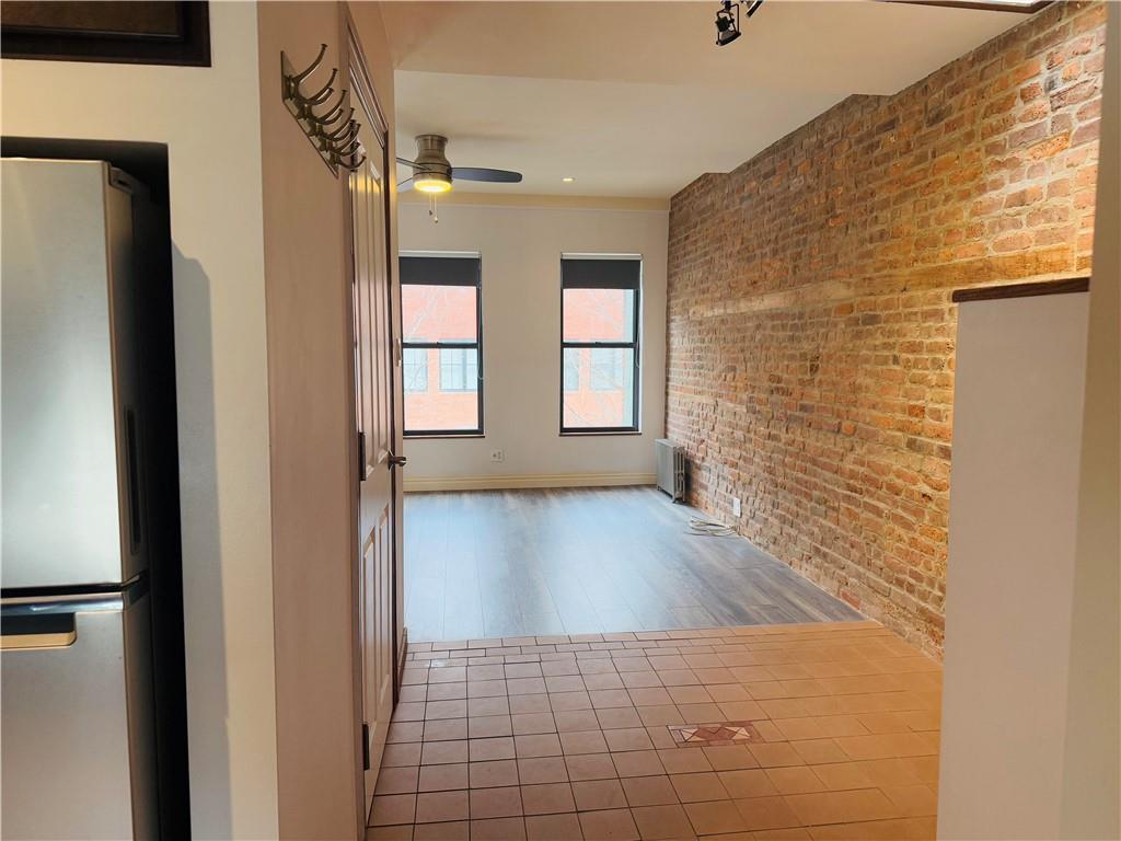 196 23rd Street Brooklyn, NY 11232 - Photo 5 of 11 a view of hallway with wooden floor and staircase