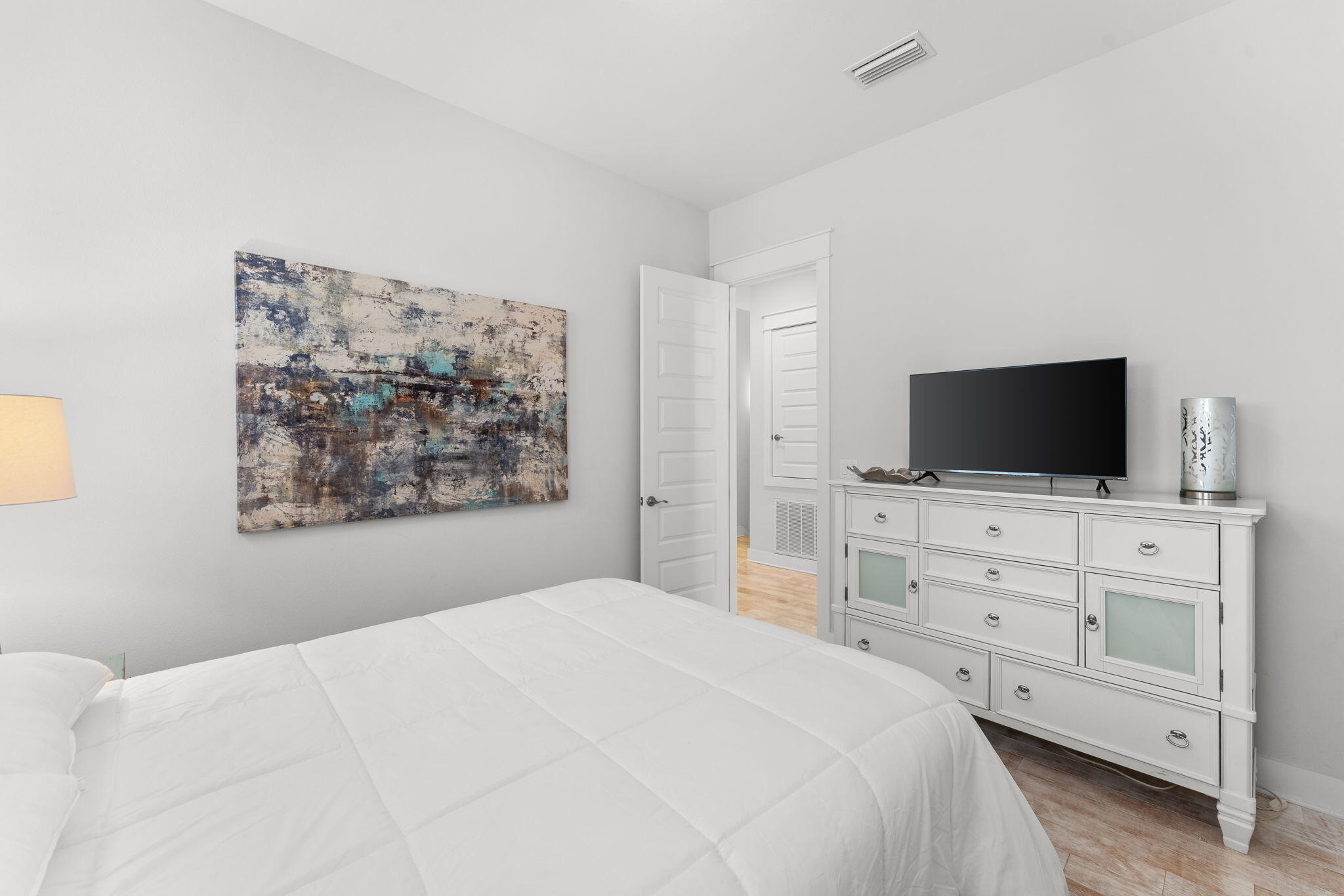 Undisclosed Address Inlet Beach, FL 32461 - Photo 11 of 44 a bedroom with a bed and a flat screen tv