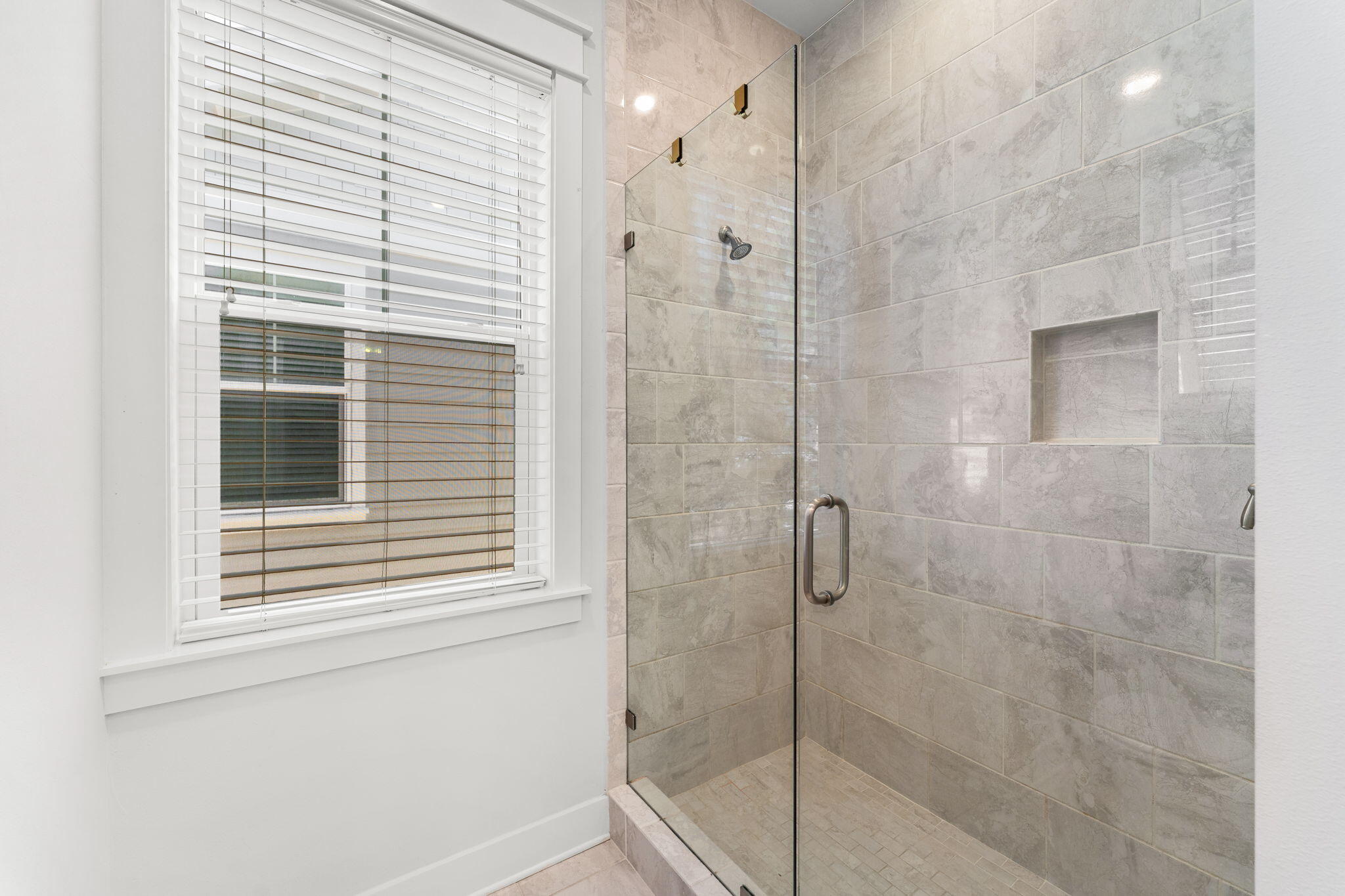 Undisclosed Address Inlet Beach, FL 32461 - Photo 26 of 44 a bathroom with a window and a shower