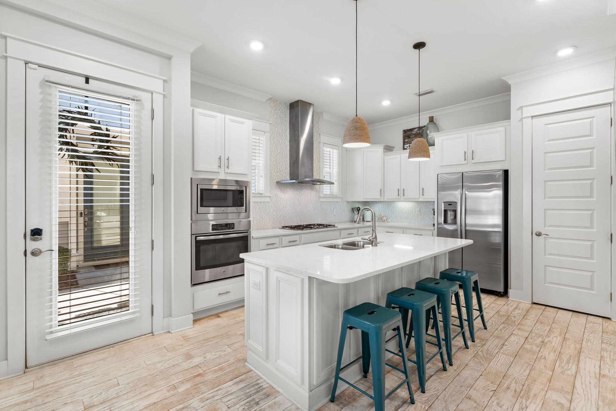 Undisclosed Address Inlet Beach, FL 32461 - Photo 27 of 44 a kitchen with kitchen island a wooden floor and white appliances