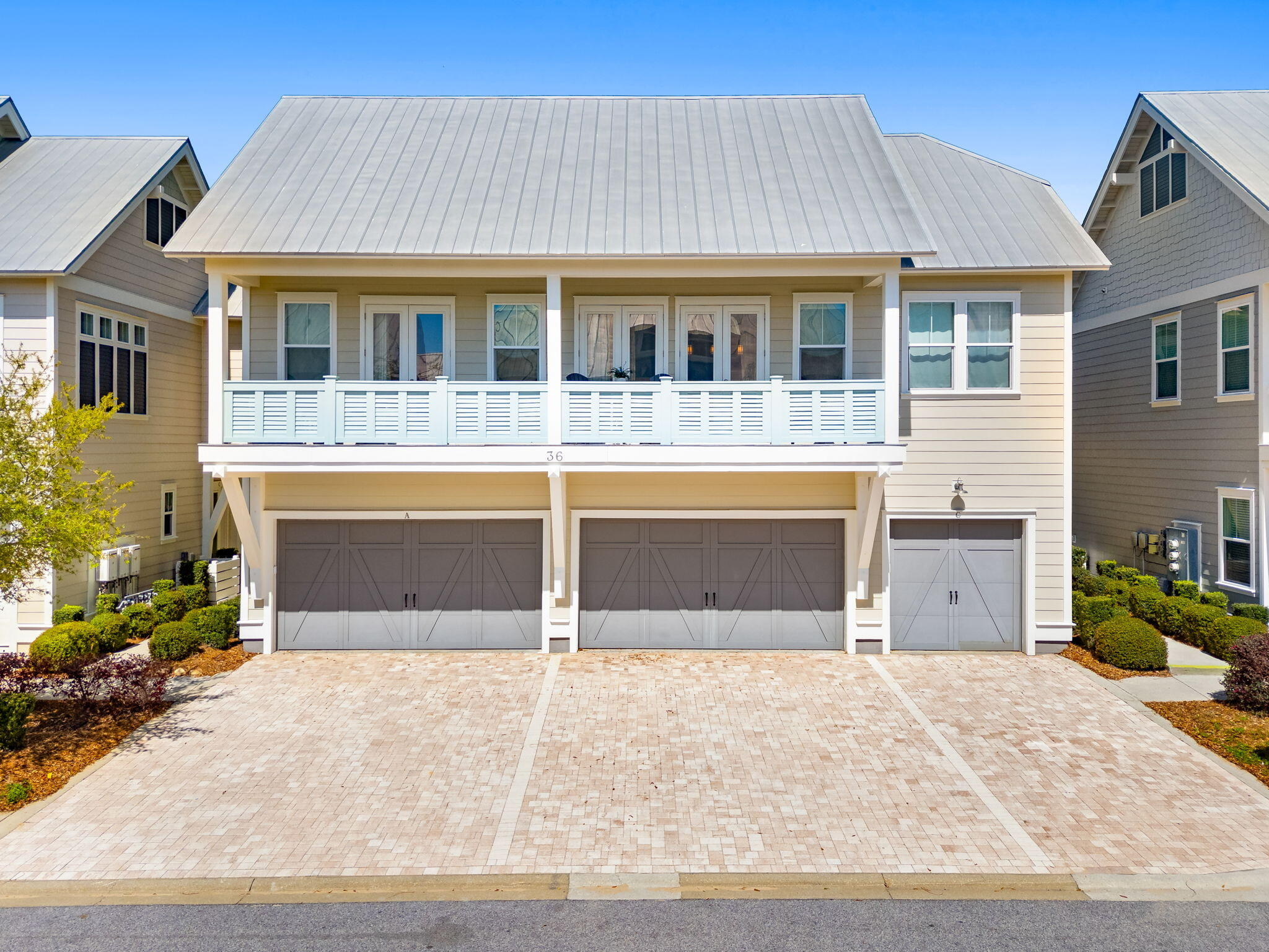 Undisclosed Address Inlet Beach, FL 32461 - Photo 34 of 44 a front view of a house with a yard and garage