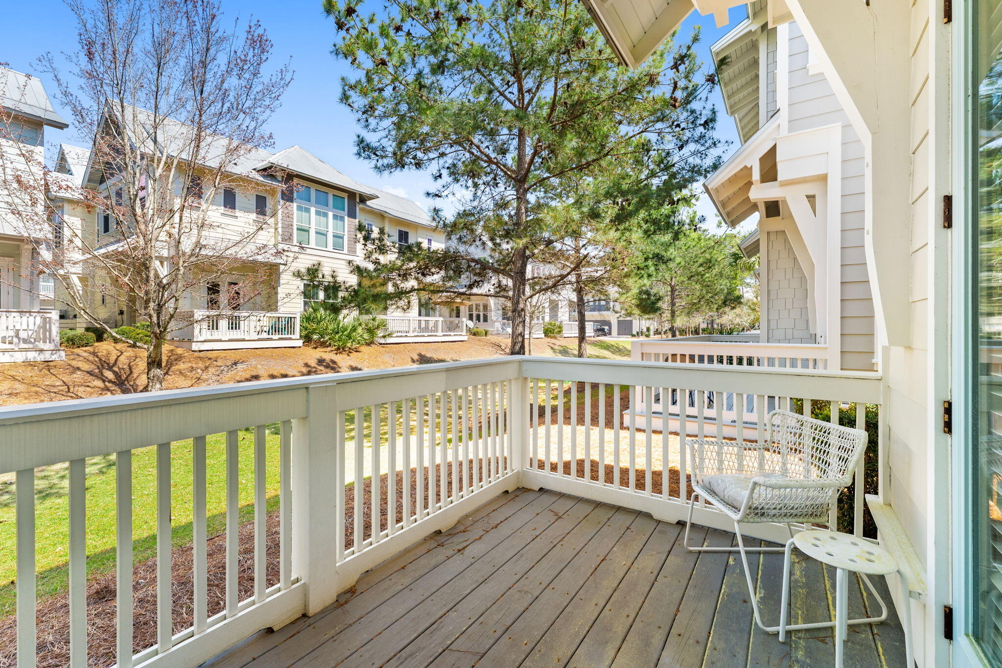 Undisclosed Address Inlet Beach, FL 32461 - Photo 8 of 44 a view of a chair and tables in the balcony