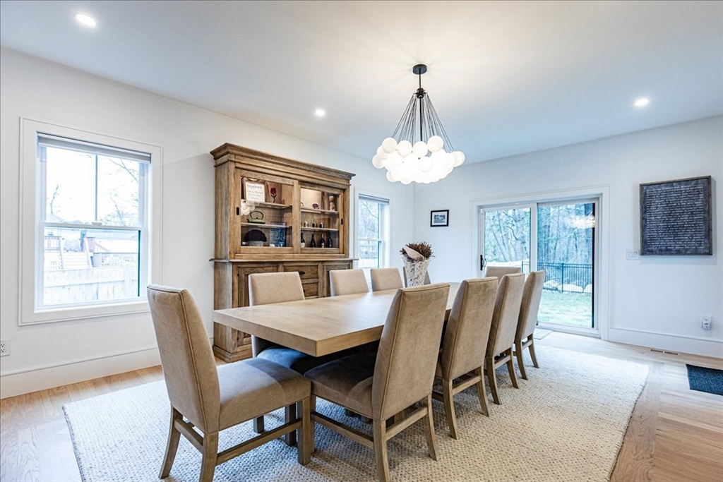 5 Brookside Lane Burlington, MA 01803 - Photo 12 of 42 a view of a dining room with furniture a chandelier and wooden floor