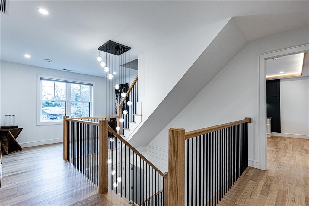 5 Brookside Lane Burlington, MA 01803 - Photo 18 of 42 a view of hallway with wooden floor and stairs