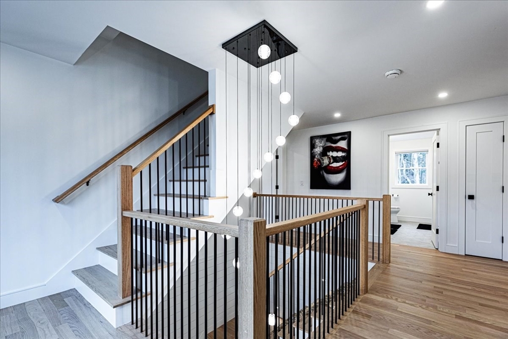5 Brookside Lane Burlington, MA 01803 - Photo 19 of 42 a view of a hallway with wooden floor and windows