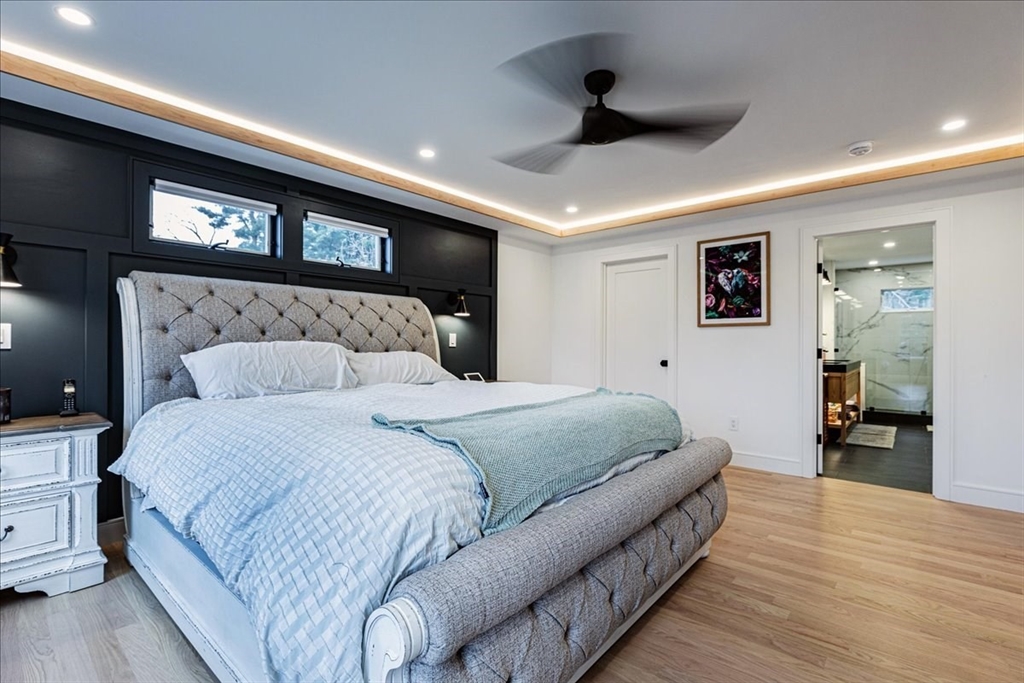 5 Brookside Lane Burlington, MA 01803 - Photo 21 of 42 a spacious bedroom with a bed and a large mirror