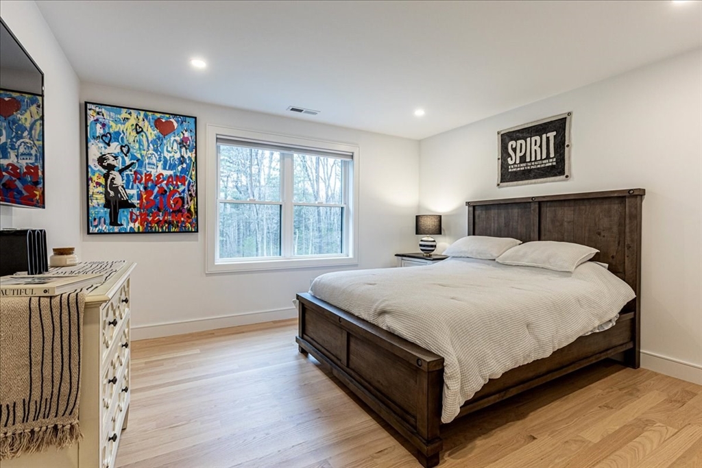 5 Brookside Lane Burlington, MA 01803 - Photo 24 of 42 a bedroom with a large bed and a window