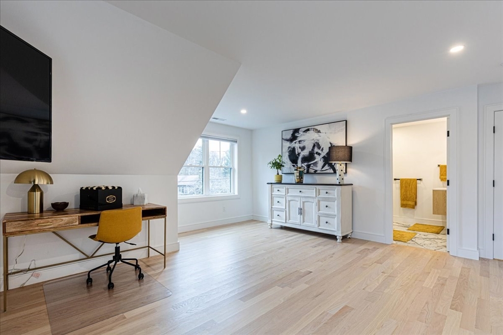 5 Brookside Lane Burlington, MA 01803 - Photo 27 of 42 a living room with furniture and a flat screen tv