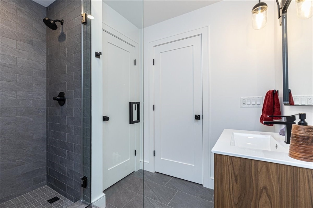 5 Brookside Lane Burlington, MA 01803 - Photo 30 of 42 a bathroom with a sink vanity and shower