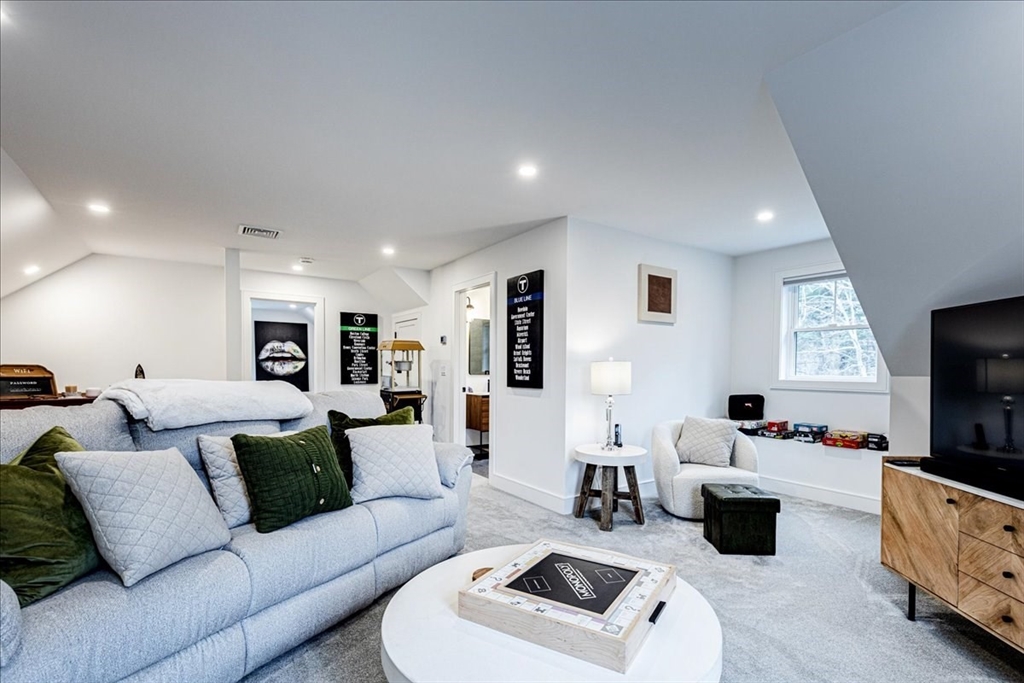 5 Brookside Lane Burlington, MA 01803 - Photo 31 of 42 a living room with furniture and a flat screen tv
