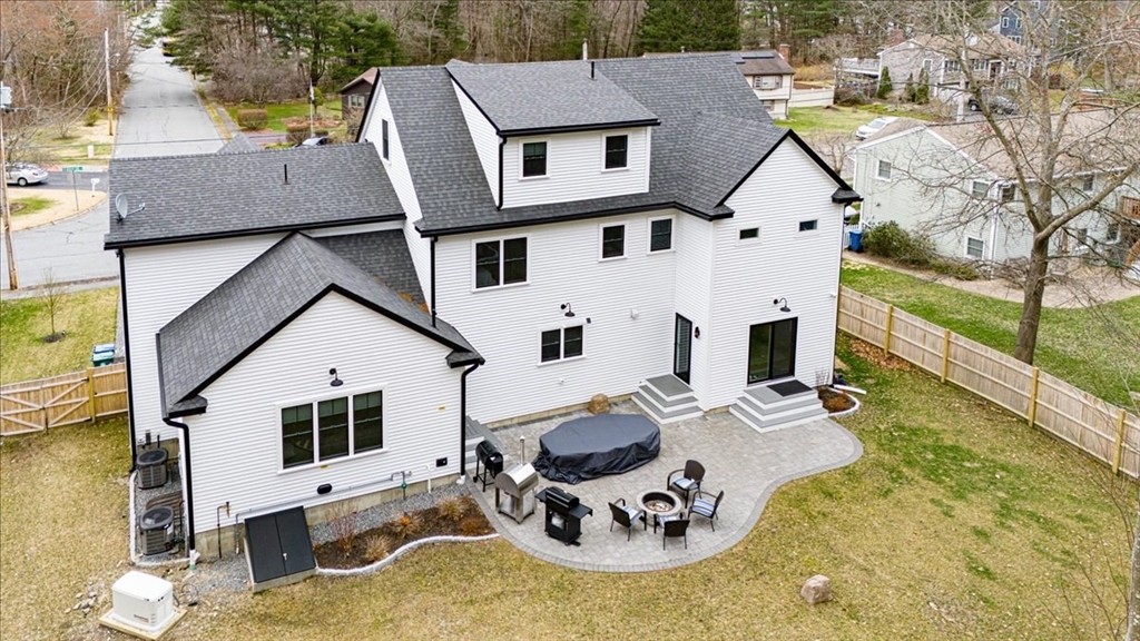 5 Brookside Lane Burlington, MA 01803 - Photo 39 of 42 a view of a white house with yard and sitting area