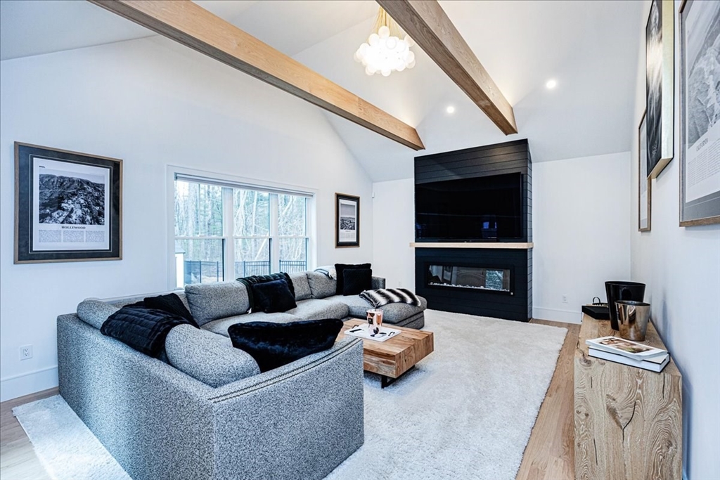 5 Brookside Lane Burlington, MA 01803 - Photo 6 of 42 a living room with furniture and a flat screen tv