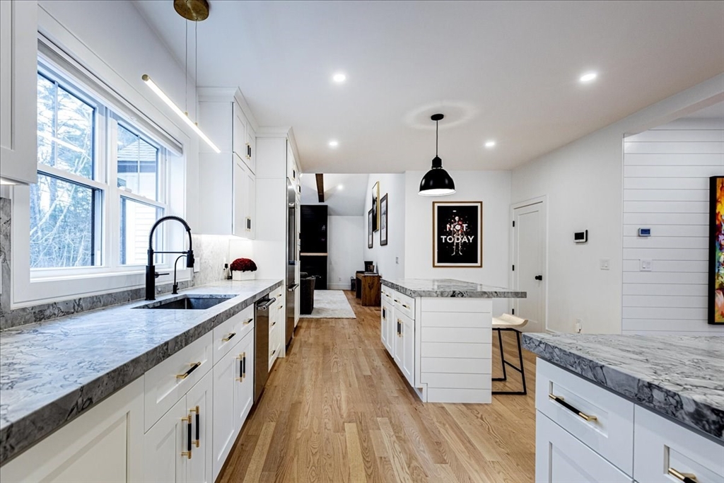 5 Brookside Lane Burlington, MA 01803 - Photo 10 of 42 a large kitchen with stainless steel appliances granite countertop a lot of counter space and a sink