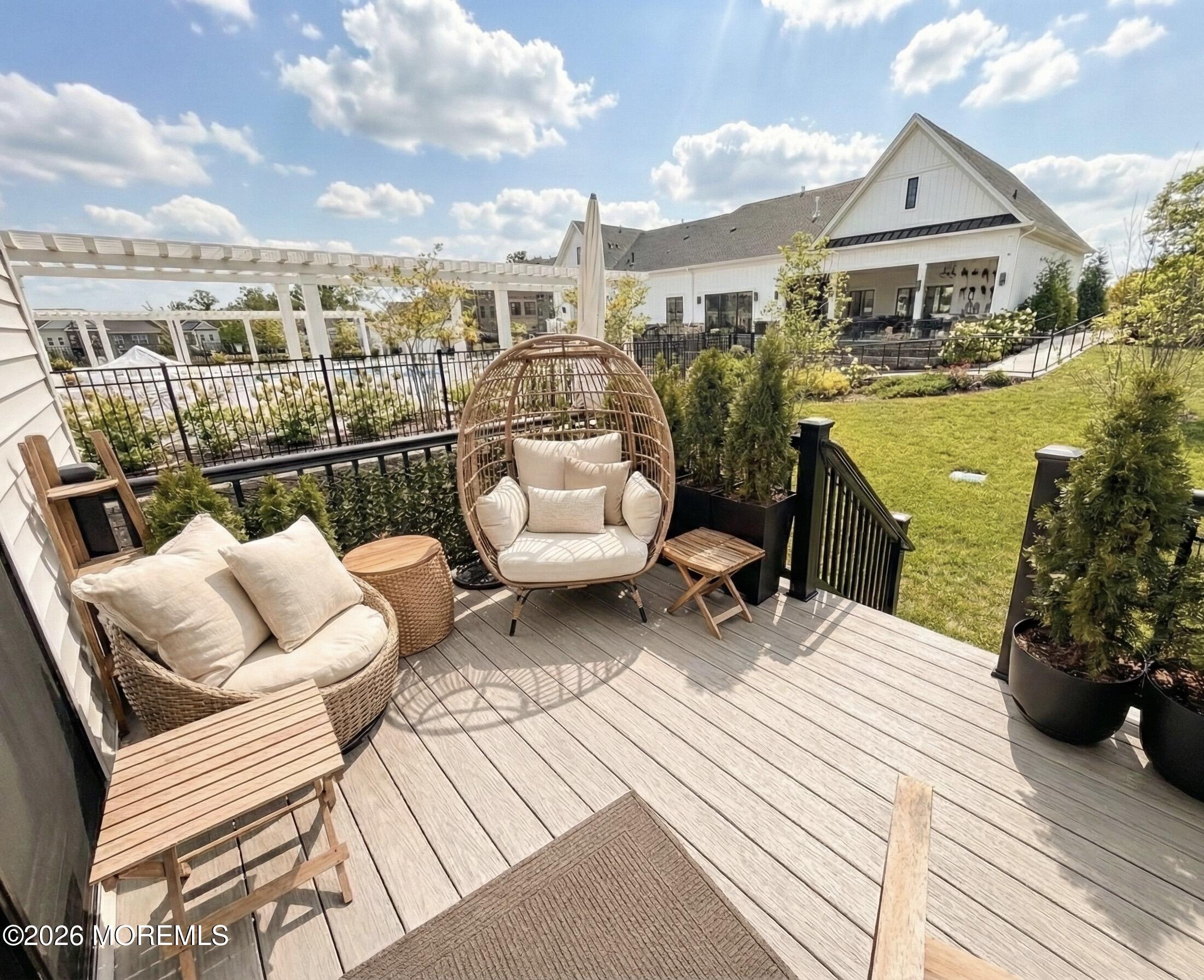 2 Valiant Court Middletown, NJ 07748 - Photo 26 of 95 a view of a balcony with two couches and a potted plant on a table
