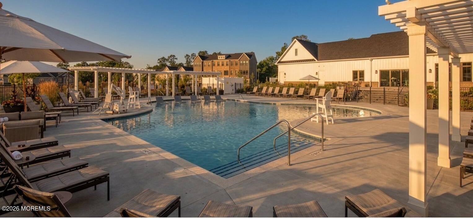 2 Valiant Court Middletown, NJ 07748 - Photo 33 of 95 a view of a swimming pool with an outdoor seating