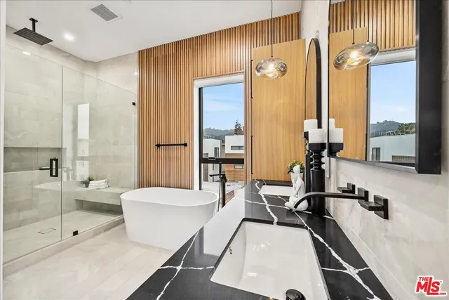 a large room with a large window and furniture