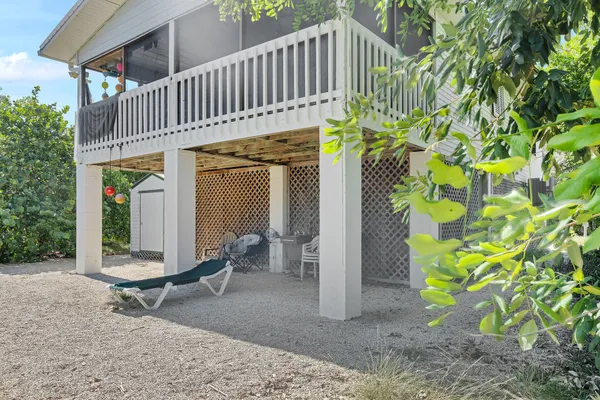 a view of a dinning table and chairs in patio