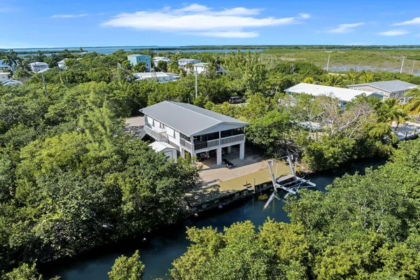 an aerial view of a house with a garden