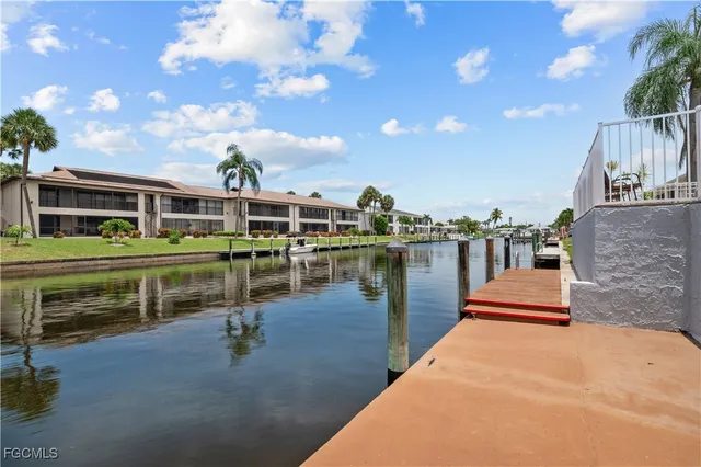 a view of house with outdoor space and lake view