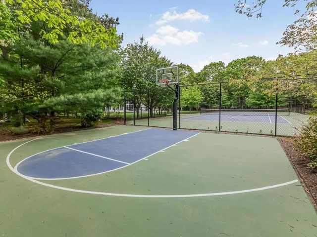 a view of a house with a yard and a garden