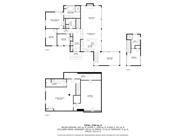 an aerial view of a house with garden space and street view