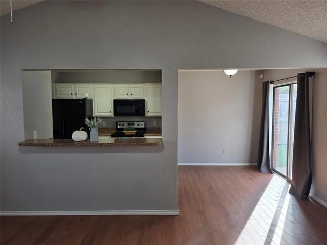 a view of kitchen with livingroom