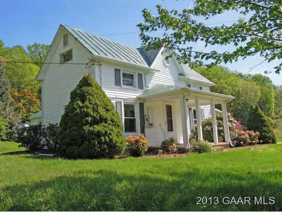 428 Beech Grove Road Roseland, VA 22967 - Photo 1 of 18 a front view of a house with a garden
