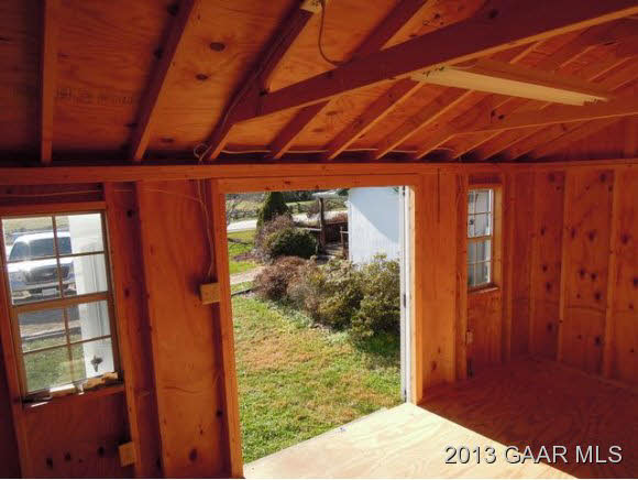 428 Beech Grove Road Roseland, VA 22967 - Photo 17 of 18 a view of a room with wooden floor and a bed