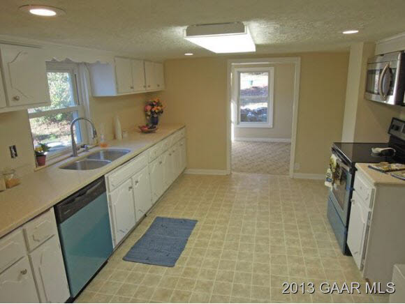 428 Beech Grove Road Roseland, VA 22967 - Photo 3 of 18 a kitchen with a sink and cabinets