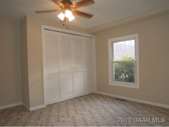 428 Beech Grove Road Roseland, VA 22967 - Photo 9 of 18 an empty room with windows and fan